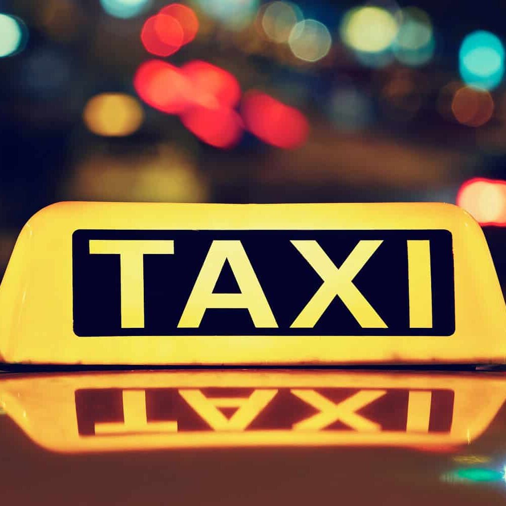 Taxi car on the street at night